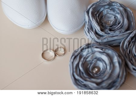Beautiful silver background with wedding rings and stars.