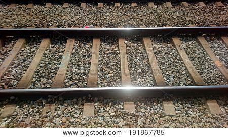 Railroad tracks shining in the mid day sun