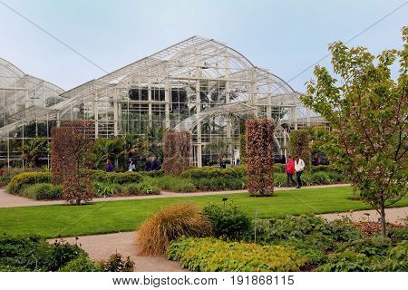 Wisley, Surrey, Uk - April 30 2017: Temperate Greenhouse And Ornate Formal Landscaped Garden