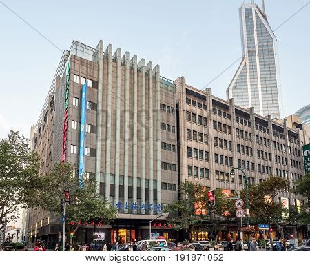 Shanghai, China - Nov 4, 2016: On Xizang Road (Middle) - Department stores block in late afternoon sunlight. Street photography.