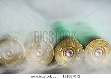 Used, Empty Cartridges For Shotguns In The Entire Frame In Smoke