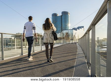 Utrecht The Netherlands - March 27 2017: Pedestrians on the Moreelsebrug (bridge) in Utrecht near central station with RABO bank building in the background.