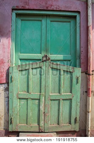 an old vintage Indian door with some shadow and sunlight
