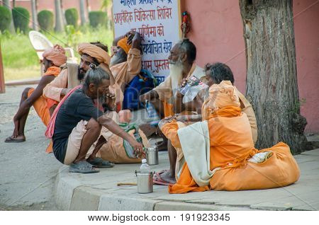 KURUKSHETRA HARYANA INDIA : 19 JUNE 2016 - Indian sadhus (holy man) sitting and chatting