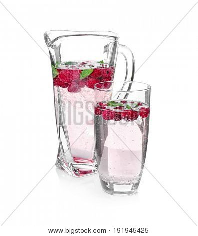 Tasty refreshing lemonade with berries on white background