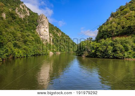 Decebal Head sculpted in rock Danube Gorges (Cazanele Dunarii) Romania.