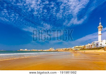Playa de la Santamaria beach and Cathedral de Santa Cruz in the morning in Cadiz, Andalusia, Spain