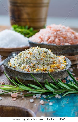 Three Different Types Of Natural Salt In Stone Bowls On Wooden Surface. White Sea Salt, Pink Himalay