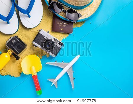 Summer Beach Vacation travel equipment and fashion on blue copy space