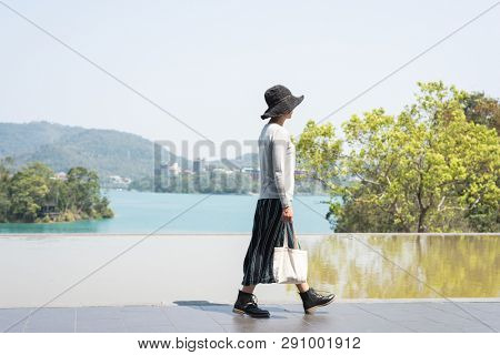 traveling Asian woman at the outdoor in daytime