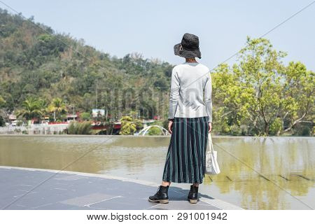 traveling Asian woman at the outdoor in daytime