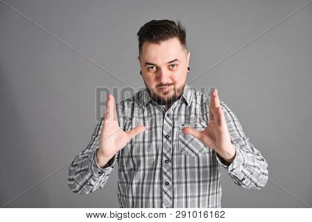 Young Bearded Man Bragging About Big Size Of Something