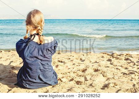 Blone Girl On Tropical Beach Vacation, Female Back Against Sea, Sand And Sky