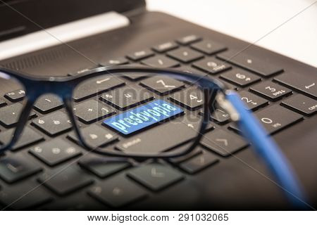 View Of The Pc Keyboard Through The Lens Of The Glasses On The Button With The Written Presbyopia