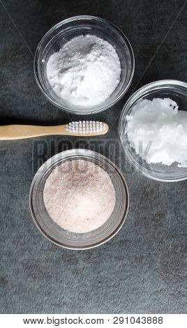 Eco-friendly Bamboo Toothbrush And Ingredients For Making Organic Toothpaste.  Vertical View And Cop
