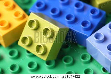 Plastic Toy Blocks On A Green Baseplate