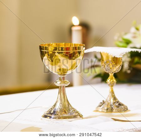 Cup With Wine And Ciborium With Host On The Altar Of The Holy Mass