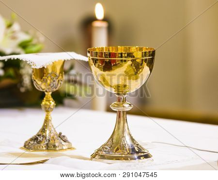 Cup With Wine And Ciborium With Host On The Altar Of The Holy Mass