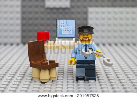 Tambov, Russian Federation - August 29, 2015 Lego Policeman Minifigure With Handcuffs Going To Arres