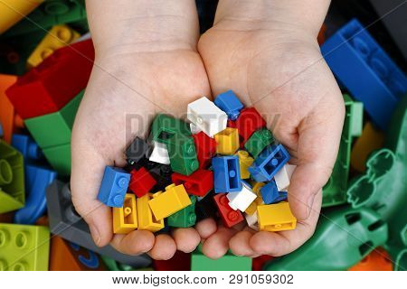 Tambov, Russian Federation - February 20, 2015 Lego Bricks In Childs Hands With Lego Duplo Blocks An
