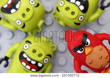 Tambov, Russian Federation - May 12, 2016 Lego Angry Birds. Red And Three Bad Piggies On Lego Gray B
