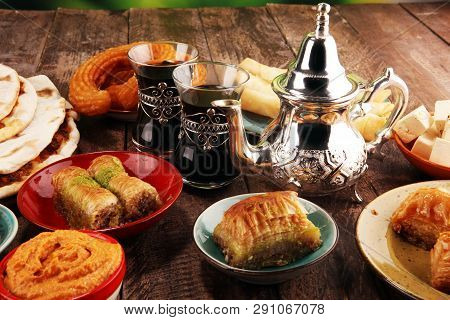 Middle Eastern Or Arabic Dishes And Assorted Meze, Concrete Rustic Background. Turkish Bread Or Turk