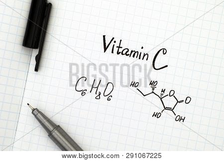 Chemical Formula Of Vitamin C With Black Pen.