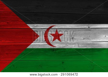 Sahrawi Arab Democratic Republic Flag Painted On Old Wood Plank. Patriotic Background. National Flag