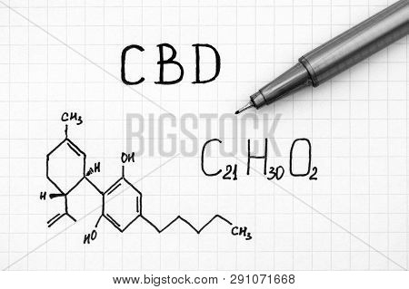 Chemical Formula Of Cannabidiol (cbd) With Black Pen. Close-up.