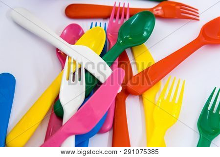 Multicolor Plastic Little Spoons On The White Background.