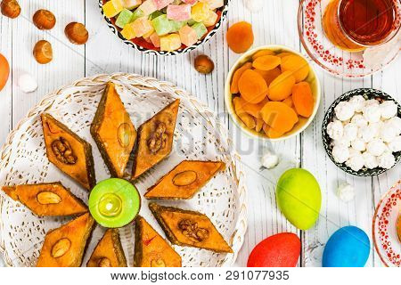 Novruz Ramadan In Azerbaijan. Colored Eggs, Wheat Springs For Easter And Traditional Sweets. Selecti
