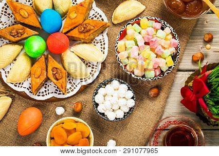 Novruz Ramadan In Azerbaijan. Colored Eggs, Wheat Springs For Easter And Traditional Sweets. Selecti