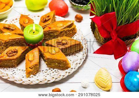 Novruz Ramadan In Azerbaijan. Colored Eggs, Wheat Springs For Easter And Traditional Sweets. Selecti