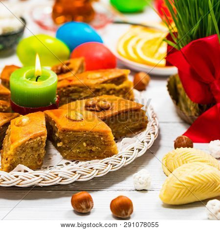 Novruz Ramadan In Azerbaijan. Colored Eggs, Wheat Springs For Easter And Traditional Sweets. Selecti