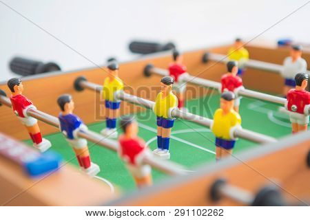 Table Football Game With Yellow And Red Players And White Goalkeeper. Table Soccer Game.