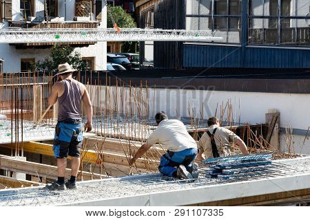 View On The Construction Site Of The House Where The Builders Work.