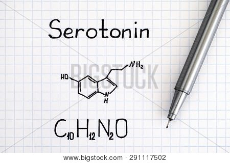 Chemical Formula Of Serotonin With Pen. Close-up.