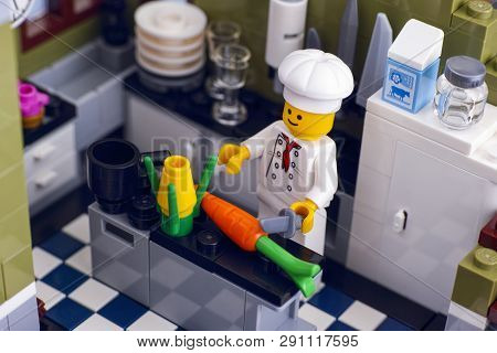 Tambov, Russian Federation - January 04, 2018 Lego Chef Cooking Vegetables In The Kitchen. Studio Sh