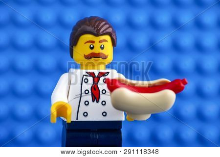 Tambov, Russian Federation - February 05, 2018 Lego Chef With Hot Dog Against Blue Baseplate Backgro
