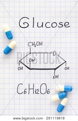 Chemical Formula Of Glucose With Some Pills. Close-up.