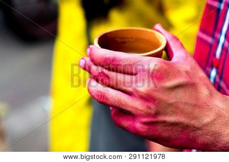 Colorful Hands Holding Earthenware Cups Of Thandai On Hindu Festival Holi