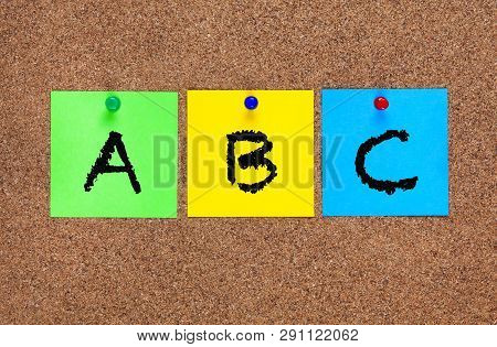 Three Blanks Notes On Corkboard With Letters Abc.