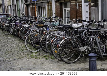 Amsterdam,netherlands - September 06, 2018: Sunset In Amsterdam.bicycle Parking And Traditional Old 