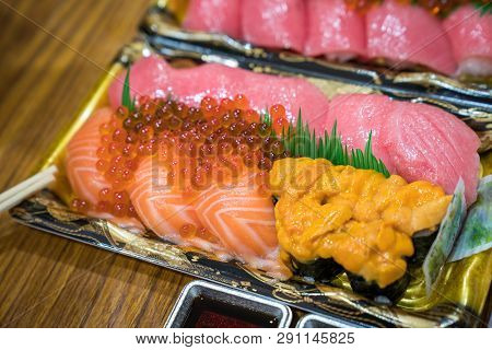 Sushi Salmon And Others Sushi Are Arranged In Foam Plant On The Table Ready To Eat At Kuromon Fish M