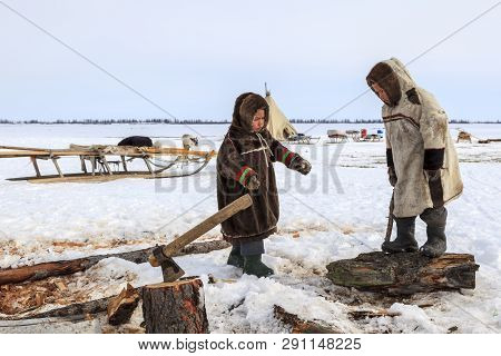 Nadym, Russia - April 27, 2018: Tundra, Open Area, The Boys In National Clothes In Cold Winter Weath