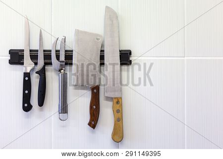Kitchen Tools, Different Knives On The Magnetic Strip, On The Wall, Set Of Knives On Magnetic Holder