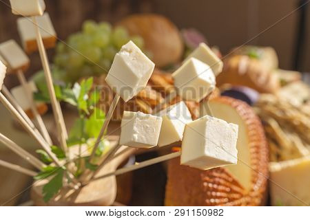 Smoked Cheese Pigtail, Traditional Polish Smoked Cheese, Chechil Cheese On The Wood Background. Smok