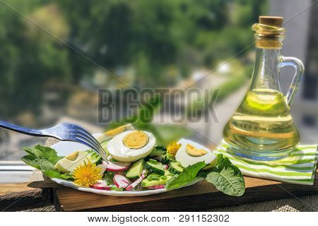 Salad Of Dandelions, Healthy Spring Salad Of Young Leaves Of Dandelion, Cucumber, Radish And Egg On