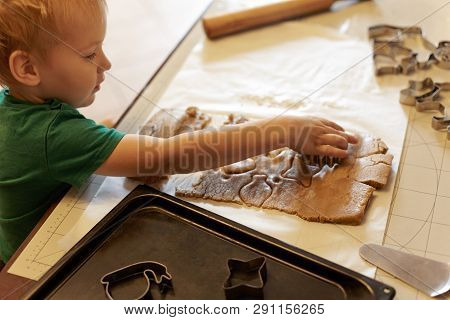 Cute Caucasian Baby Boy Helps In Kitchen, Making Homemade Coockies. Casual Lifestyle In Home Interio