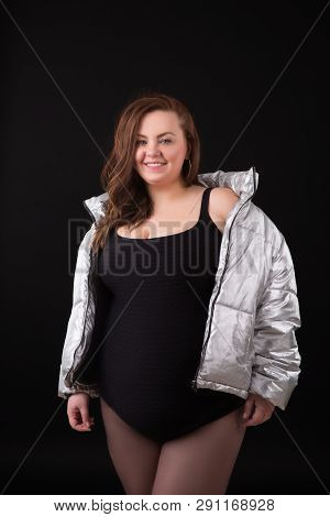 Beautiful Young Woman Plus Size With Big Bust In Underwear And Down Jacket